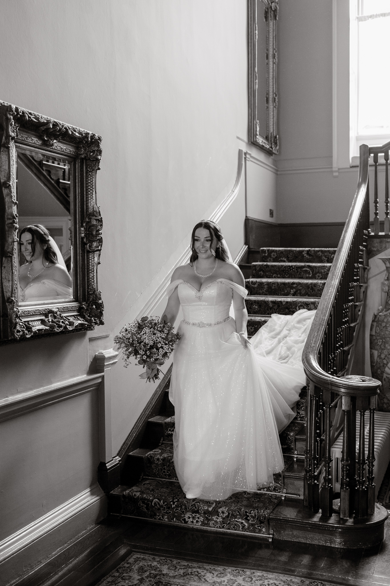 Peterstone Court Wedding - Bride walking down the stairs