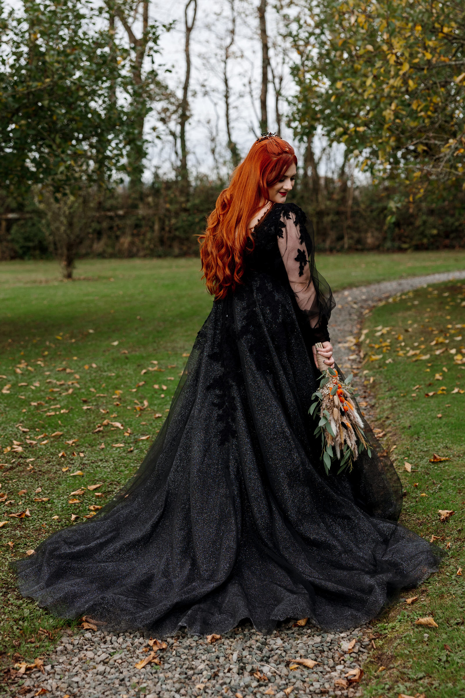 Cardeeth wedding. Bride wearing Black wedding dress for her halloween wedding