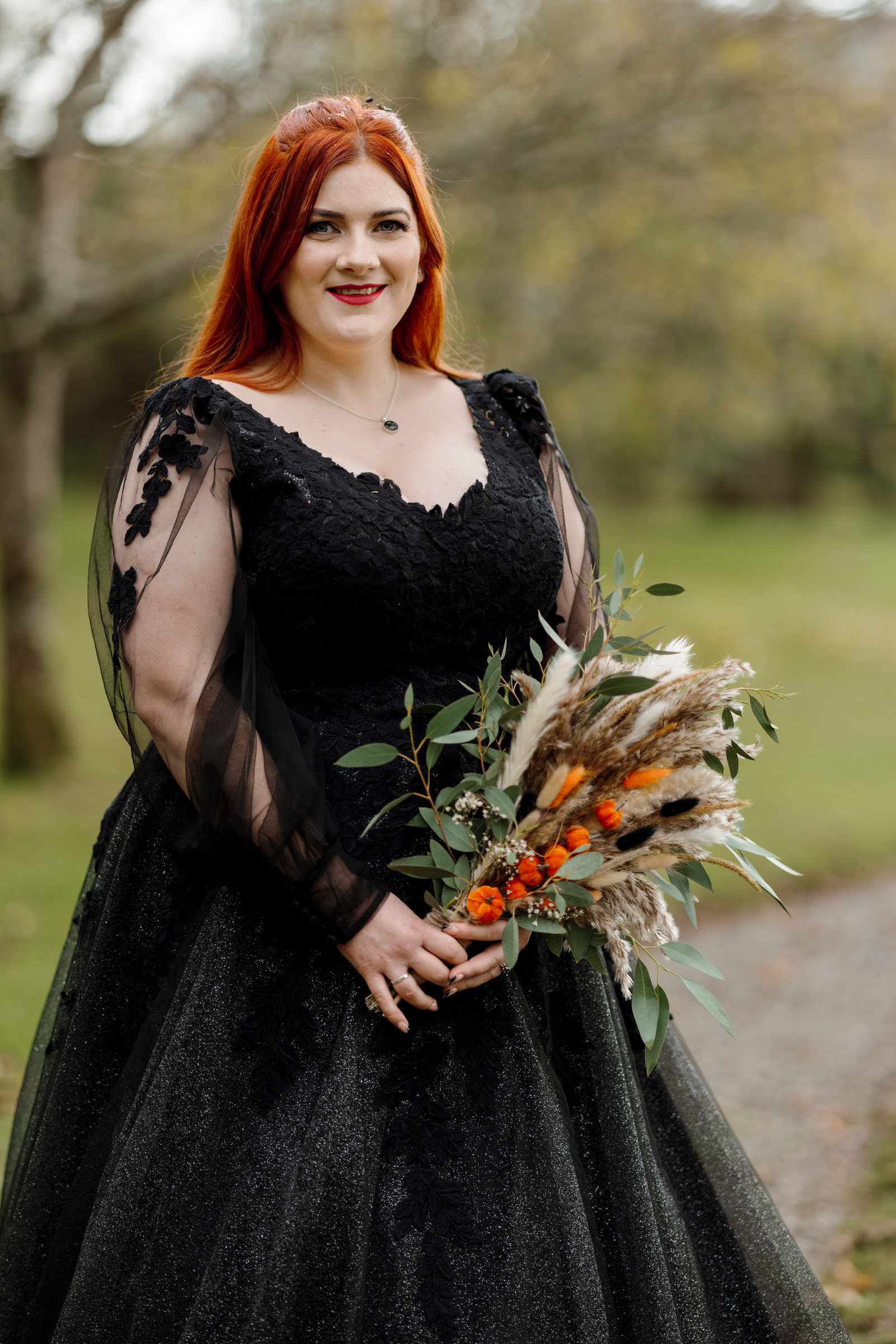 Cardeeth wedding. Bride wearing Black wedding dress for her halloween wedding